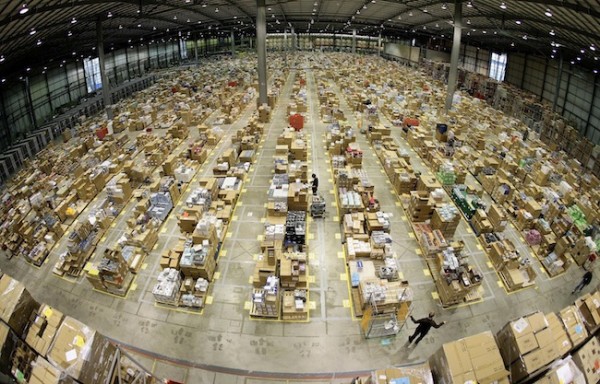 Workers are seen in the Amazon.co.uk warehouse in  Milton Keynes, north of London