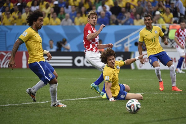 Brazil's defender Marcelo (L) scores an