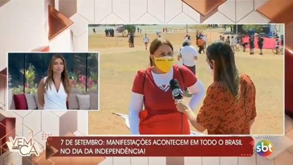 Manifestante solta um "fora Bolsonaro genocida" ao vivo no SBT