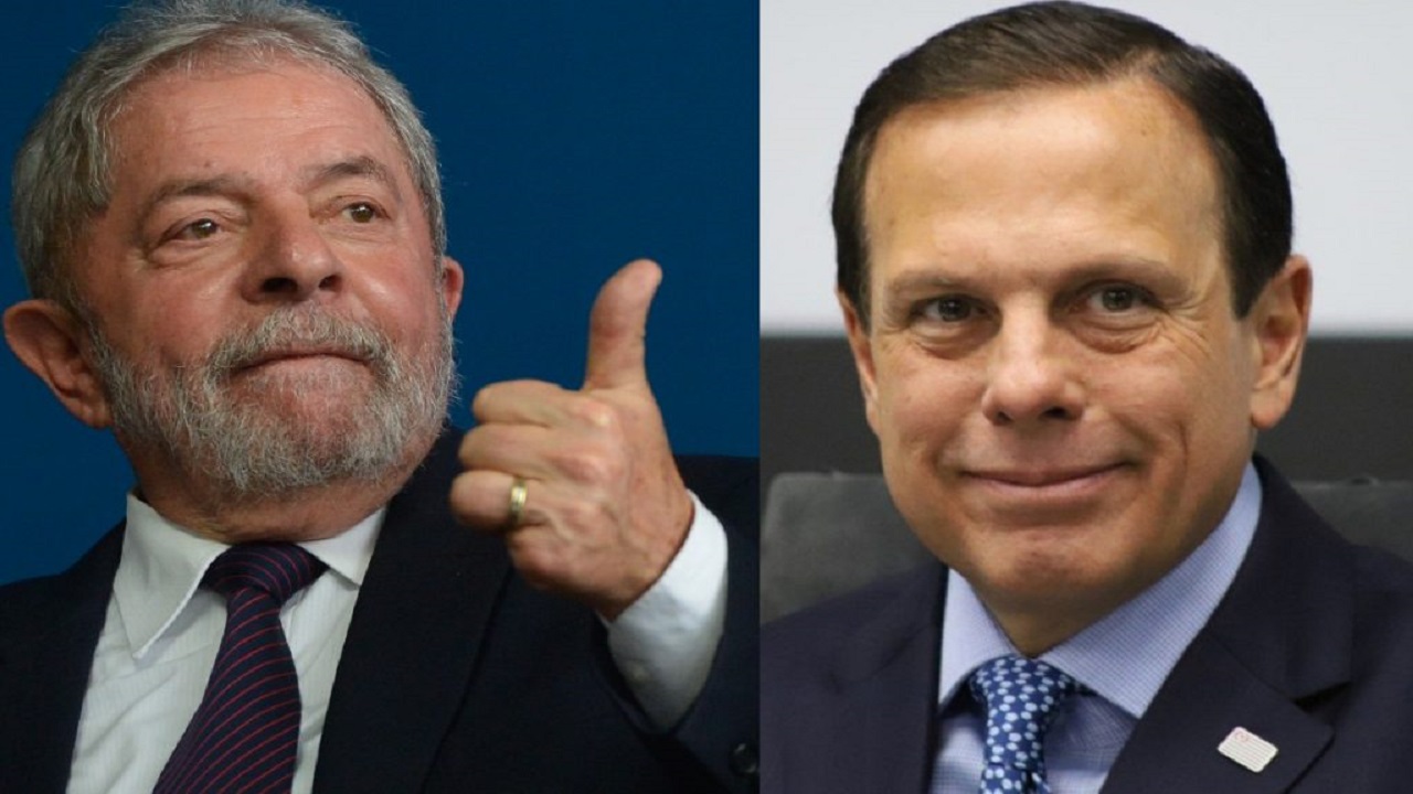 Montagem com Lula, fazendo um joinha, ao lado de Doria.