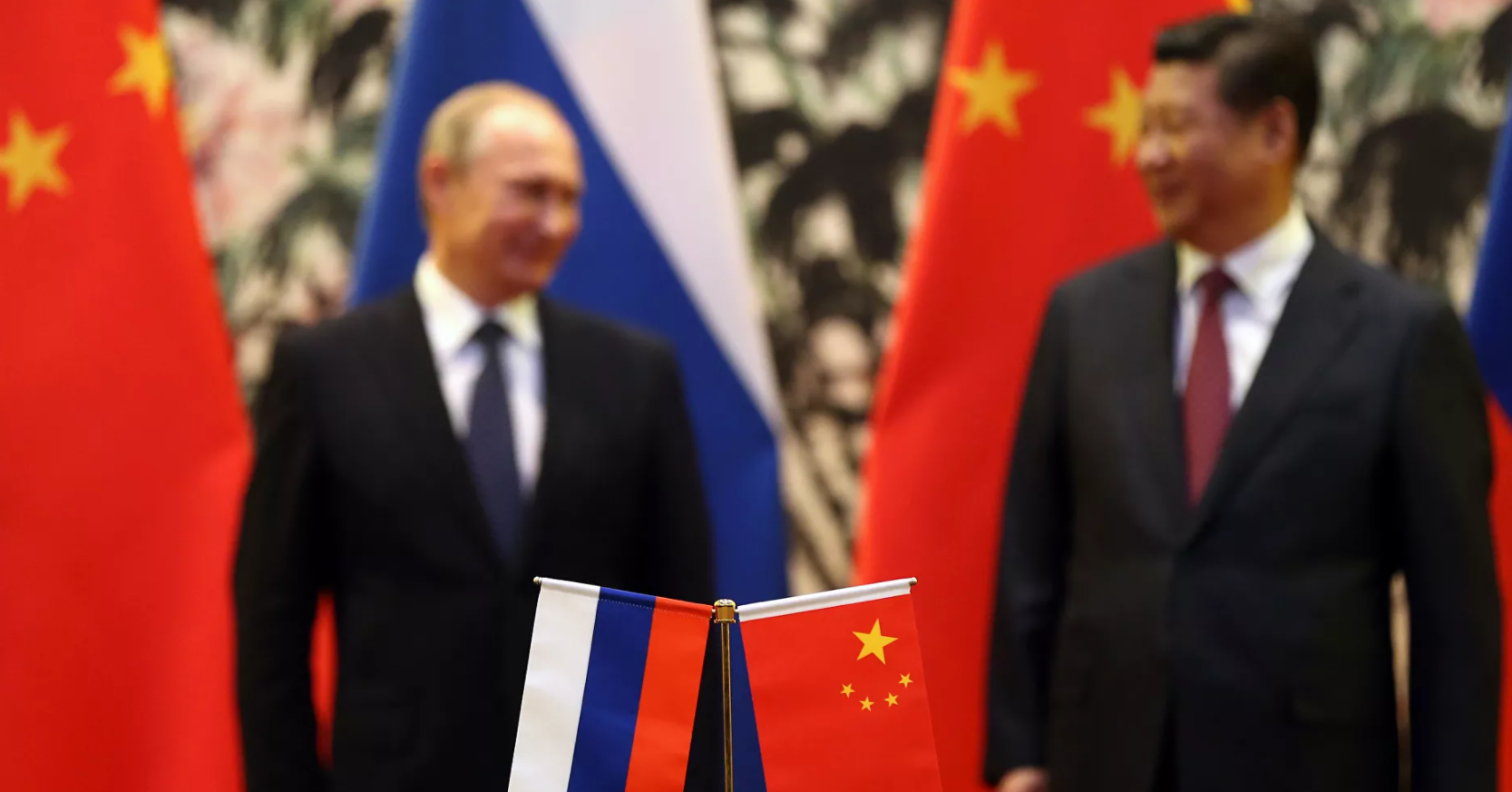 Os presidentes da Rússia e da China, Putin e Xi Jinping. Foto: AFP/How Hwee Young