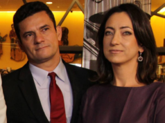 Foto de Moro e Rosangela com rousas de gala um ao lado do outro durante um evento.