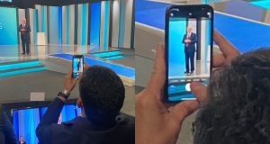 Montagem de fotos de Moro tirando foto de Lula