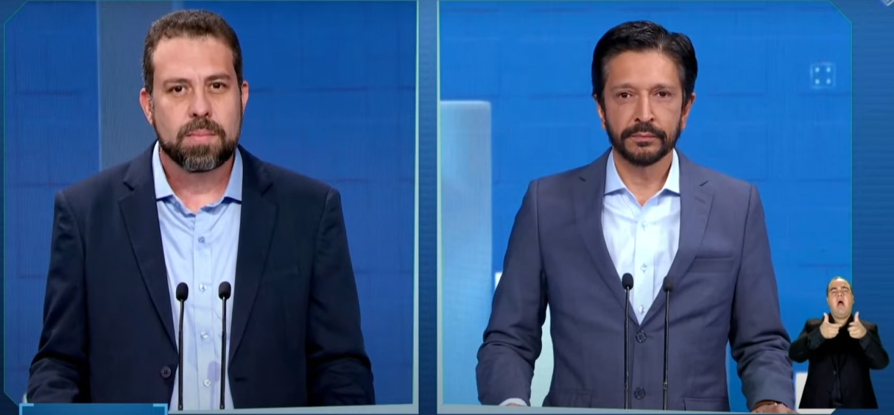 Montagem de fotos de Guilherme Boulos e Ricardo Nunes, ambos serios e olhando pra frente