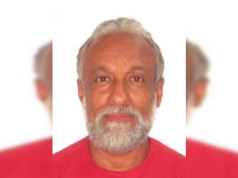 policial federal Wladimir Matos Soares no centro de montagem, de camiseta vermelha, sério, olhando para a câmera