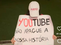 Isabel Peres com boné e faixa pedindo Justiça