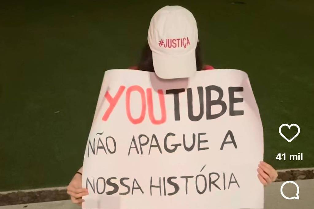 Isabel Peres com boné e faixa pedindo Justiça