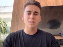 deputado federal Nikolas Ferreira (PL-MG) de camiseta preta, olhando para a câmera com expressão confusa