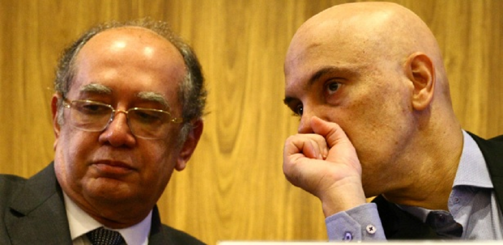 Gilmar Mendes e Alexandre de Moraes lado a lado, conversando, em close