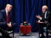 Donald Trump e Lula sentados frente à frente, falando