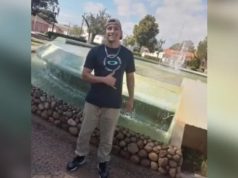 Deivison Andrade de Lima sorrindo e posando para foto no centro de montagem