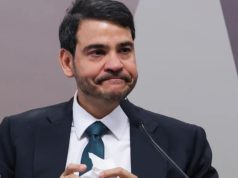 advogado-geral da União Jorge Messias com expressão de preocupação, sem olhar para a câmera