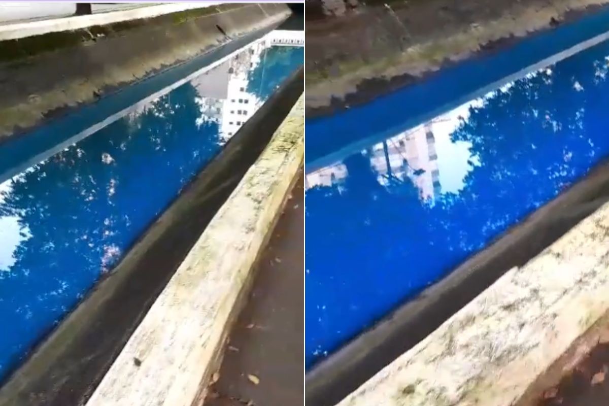 Água do Canal 4 de Santos com coloração azul fluorescente