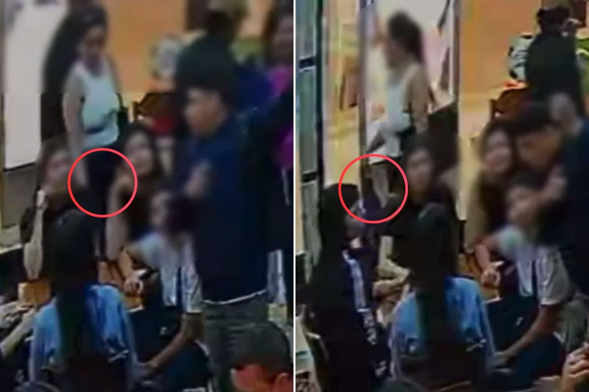 Mulher próxima a mesas em shopping de São Vicente
