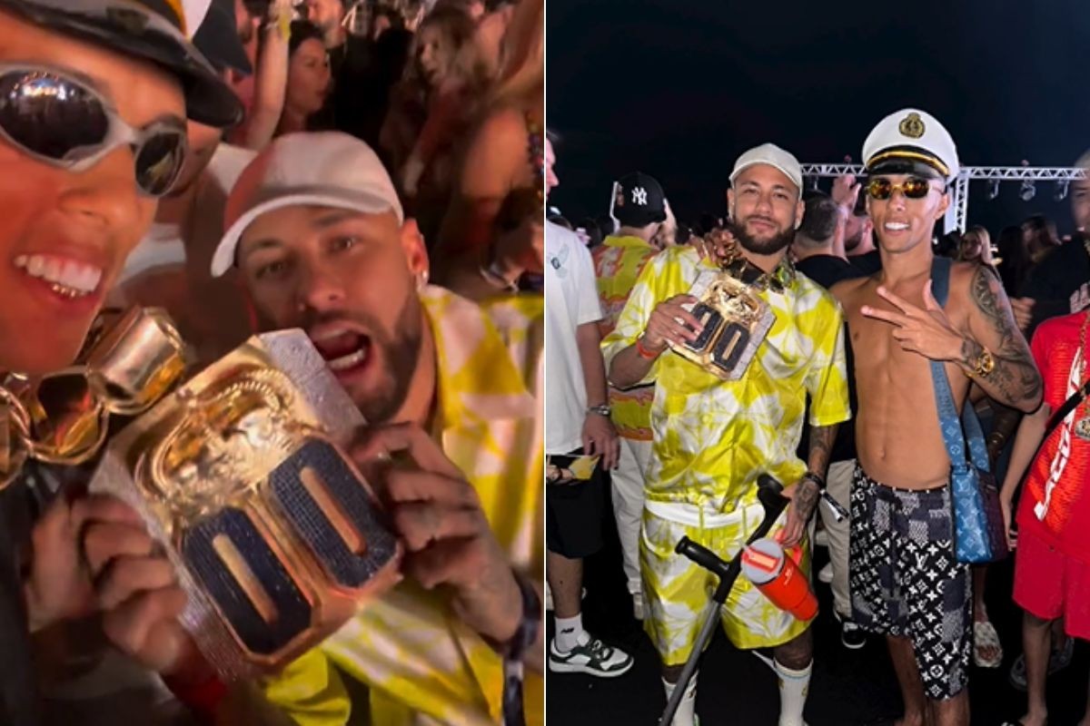 Buzeira e Neymar Jr. durante cruzeiro com colar de ouro