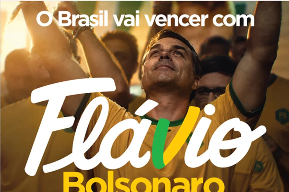 Letra V estilizada nas cores verde e amarelo integrada ao nome Flávio
