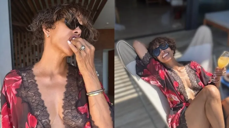 Halle Berry usa robe estampado e decotado