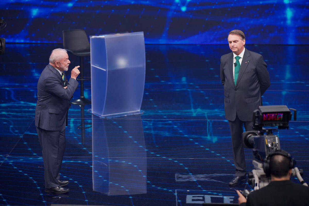 Lula e Jair Bolsonaro em debate eleitoral da Band em 2022