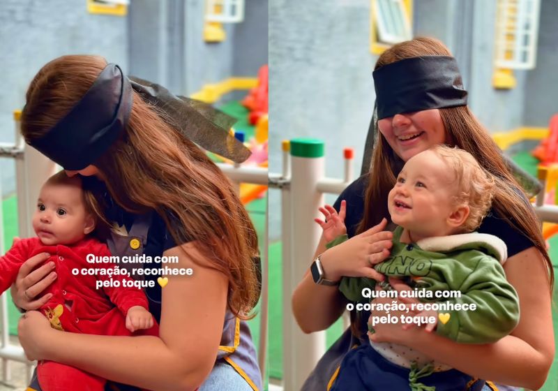 Professora vendada segura bebê no colo durante brincadeira na creche