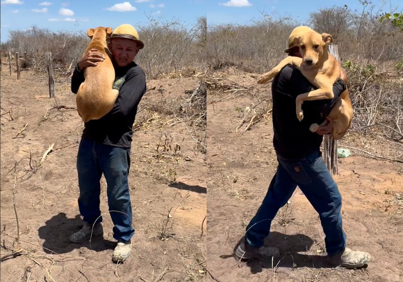 Gonzaguinha carrega o cachorro Bastião no colo em terreno de areia