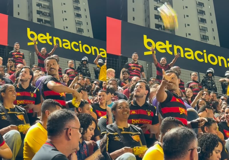 Torcedores recebem pacotes de pipoca na arquibancada durante jogo de futebol