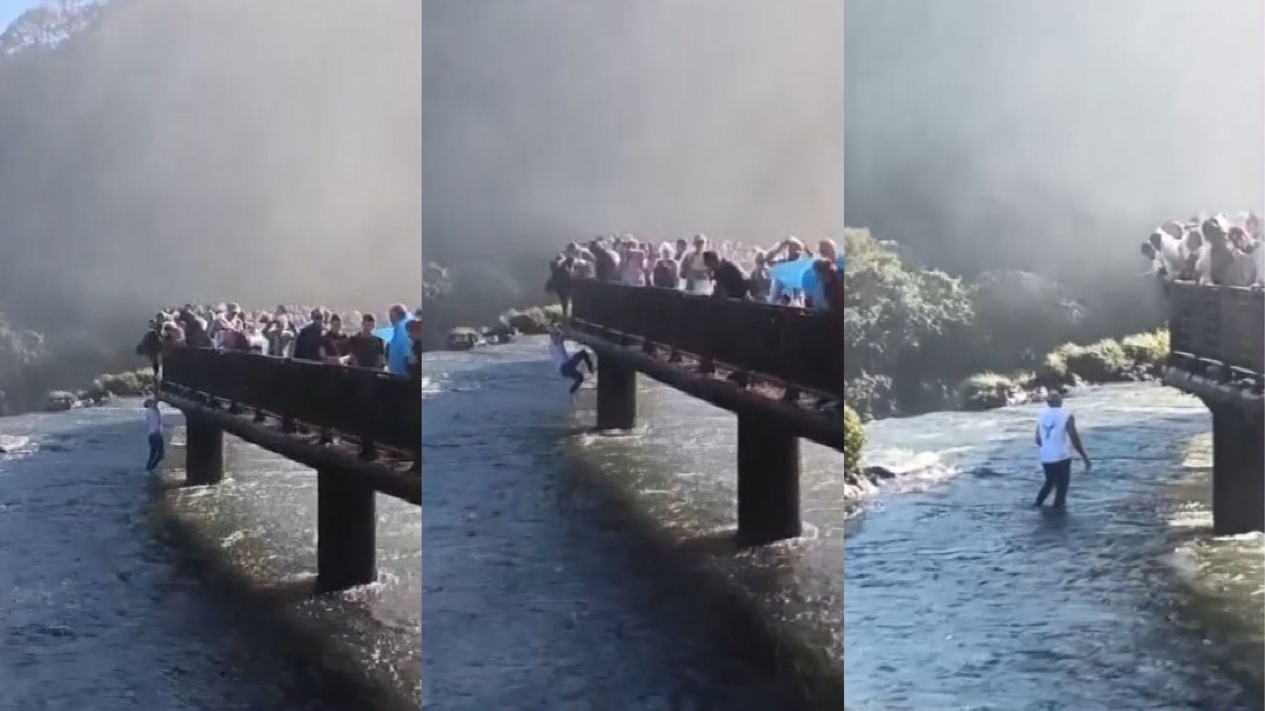 Turista pendurado no guarda-corpo da passarela das Cataratas do Iguaçu
