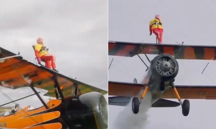 Helga Duffy presa à asa de um avião durante voo acrobático
