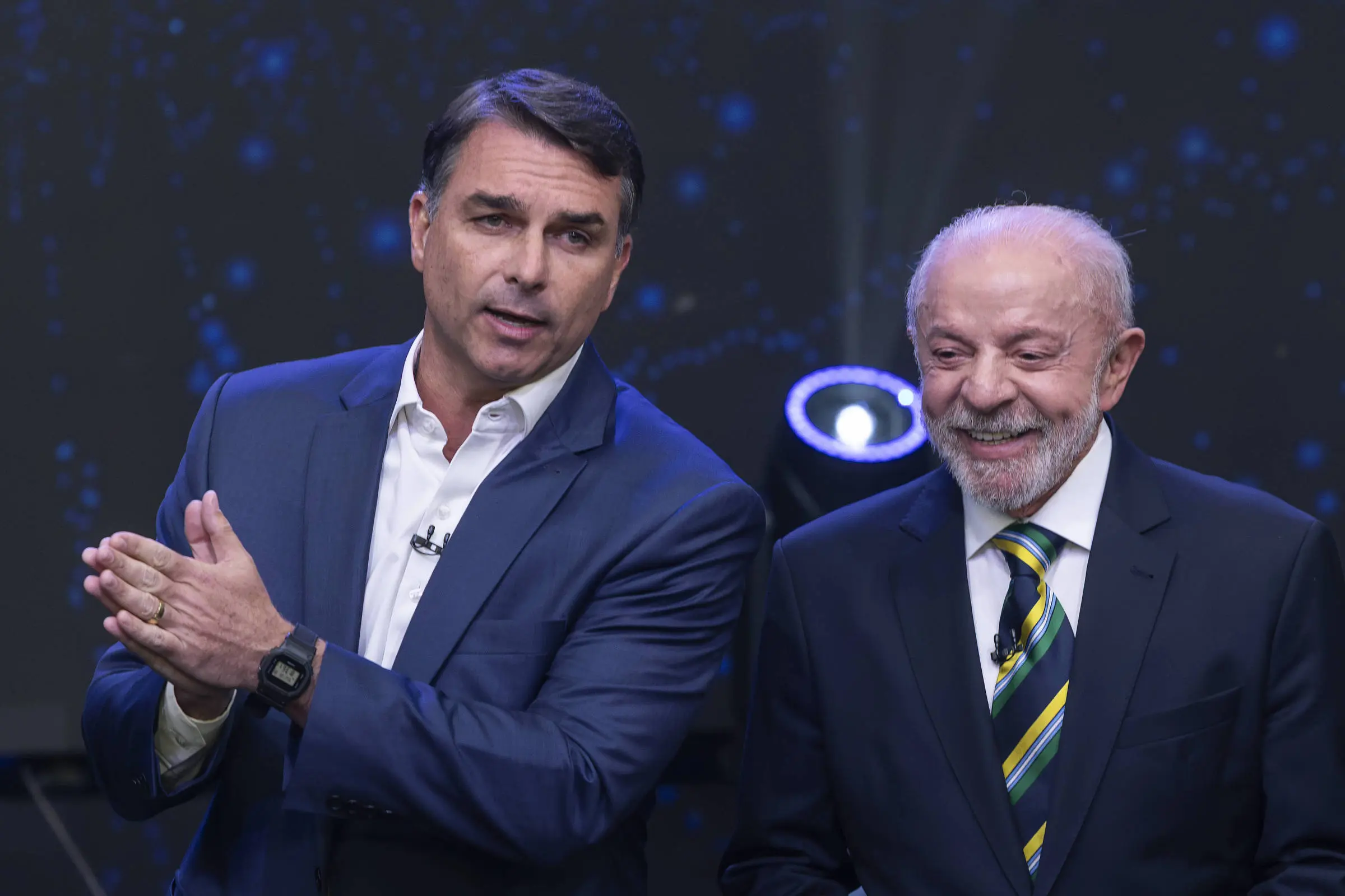 Lula e Flávio Bolsonaro em debate da Band