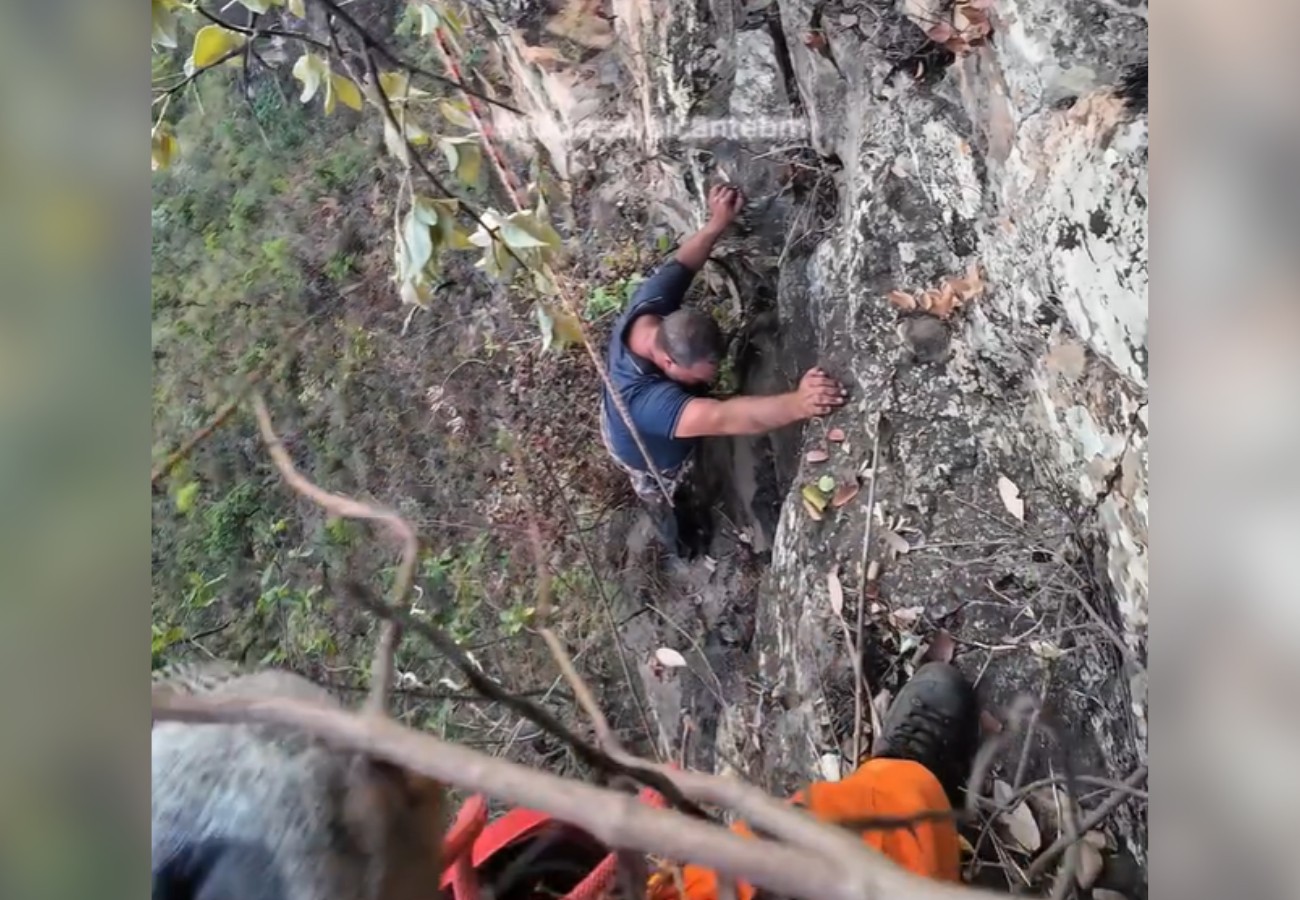 Homem pendurado em penhasco na Serra de Taguatinga