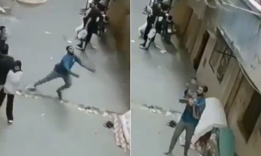 Ahmed Ragab segura criança após resgate em Gizé, no Egito