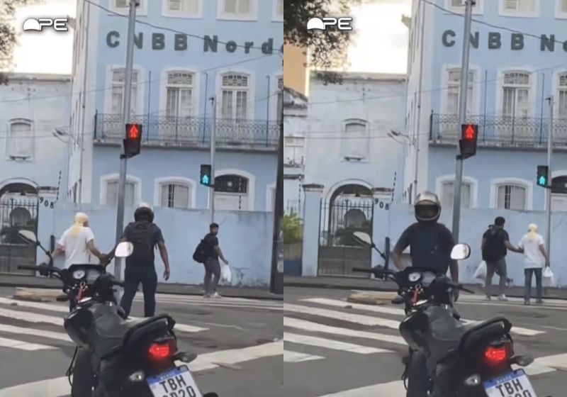 Motociclista ajuda idosa a atravessar avenida no Recife