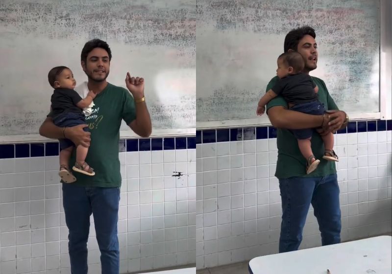 Professor Ramires Vieira segura bebê no colo durante aula